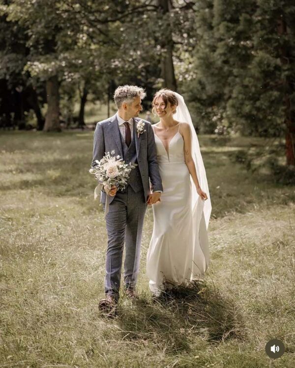 bride & groom with wedding flowers bouquet and buttonholes